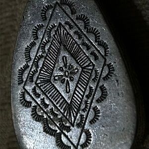 Navajo sterling silver pendant with hand-stamped designs
  Necklace